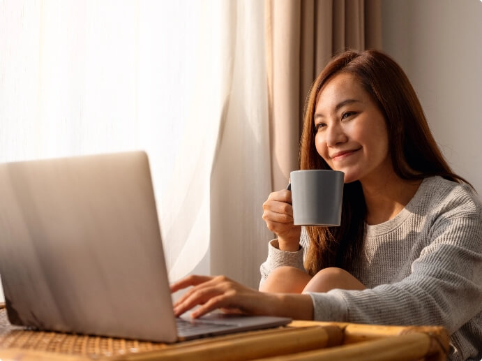 Happy Woman Holding A Cup Of Tea Image